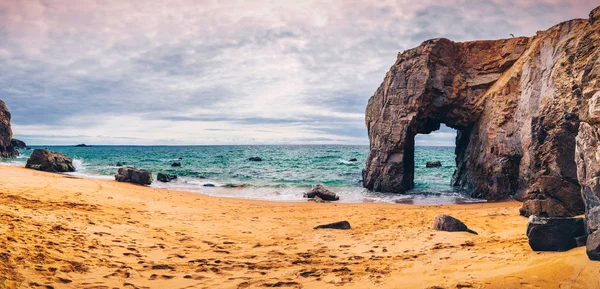 Spectacular natural cliffs and stone arch Arche de Port Blanc an — Stock Photo, Image
