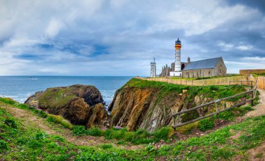 Panorama of lighthouse and ruin of monastery, Pointe de Saint Ma clipart