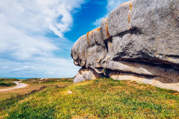 The pink granite rocks with strange shapes, coast in Brittany. T
