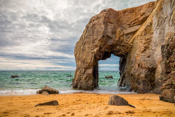 Spectacular natural cliffs and stone arch Arche de Port Blanc an — Stock Photo, Image