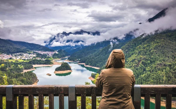 Traveler relaxing meditation with serene view mountains and lake