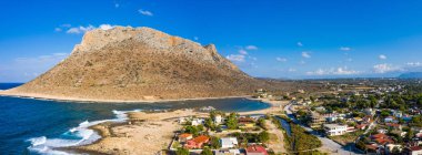 Aerial drone top view of turquoise organised beach forming a sma