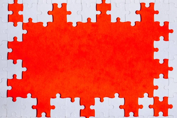 Beyaz bir yapboz puzzl yapılmış bir dikdörtgen şeklinde çerçeveleme — Stok fotoğraf