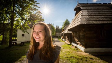 Girl in the historical ancient museum village Zuberec Brestova in Slovakia clipart