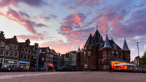 Exterior view of the Weigh House or De Waag Building at the sunset, Amsterdam, Netherlands