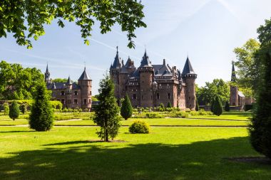 View of the gardens and the exterior of the De Haar Castle, Netherlands clipart