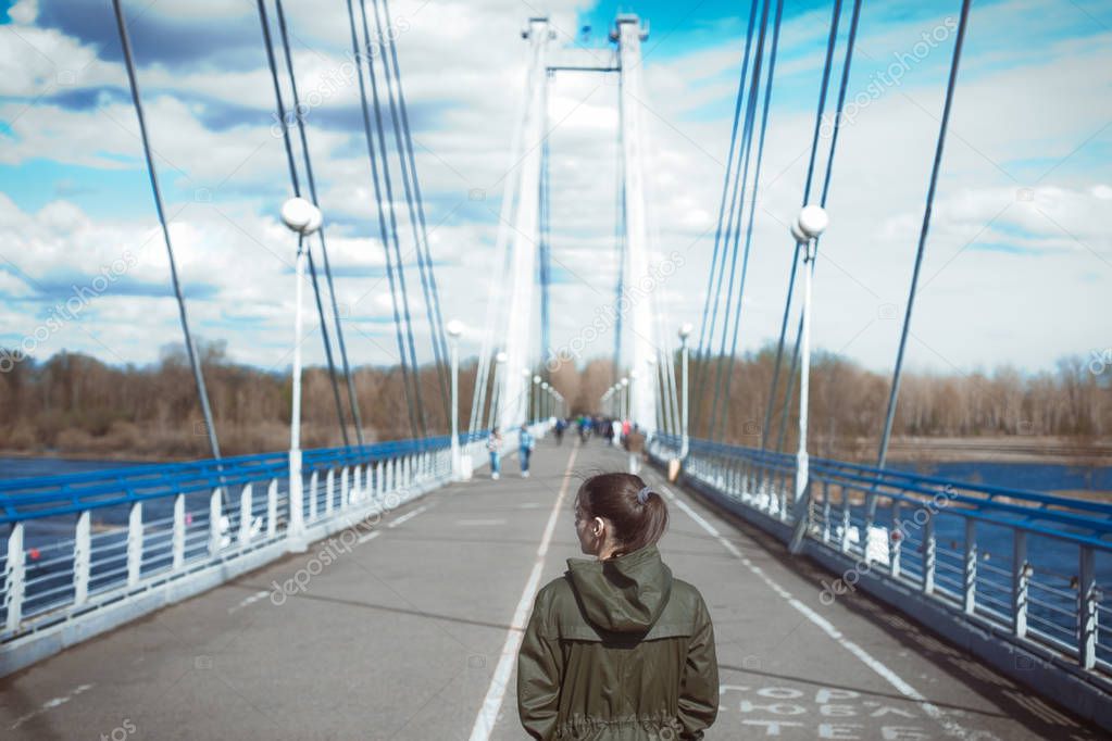Girl on the pedestrian bridge in Krasnoyarsk