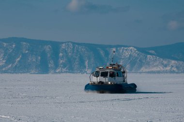 Hovercraft rides on lake Baikal, Listvyanka village clipart