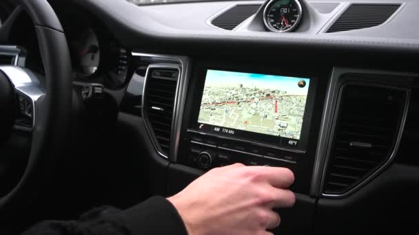 Man uses a gps navigator in the car — Stock Video