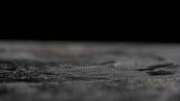 Nuts fall on the table close-up black background — Stock Video