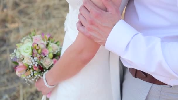 The man is hugging the bride close-up — Stock Video