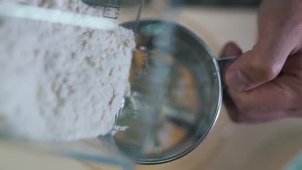 Man sifts flour close up — Stock Video