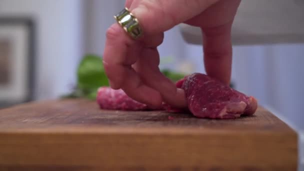Man cuts red meat close-up — Stock Video