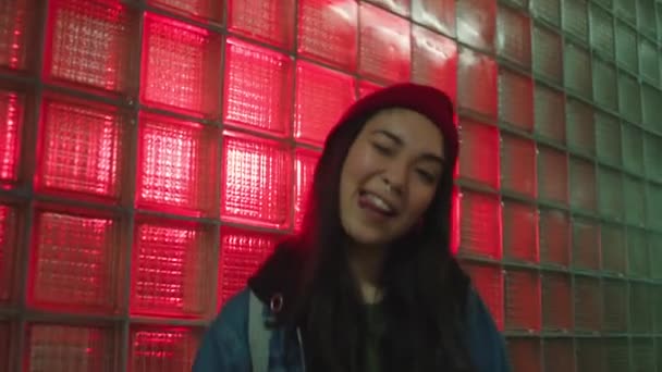Stylish urban girl in neon light — Stock Video