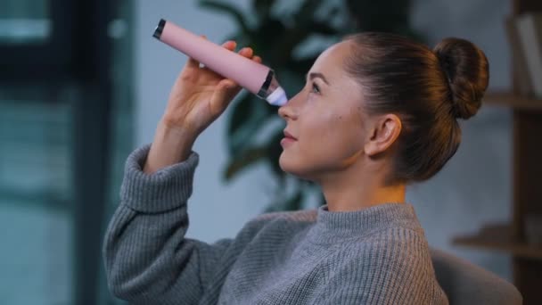 Girl uses face pore vacuum cleaner — Stock Video