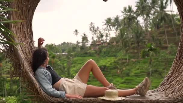 Girl resting on the background of rice fields — Stock Video