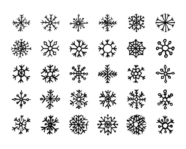 Copos de nieve dibujados a mano sobre fondo blanco — Archivo Imágenes Vectoriales