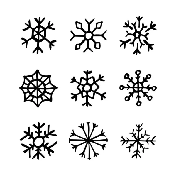 Copos de nieve dibujados a mano sobre fondo blanco — Vector de stock