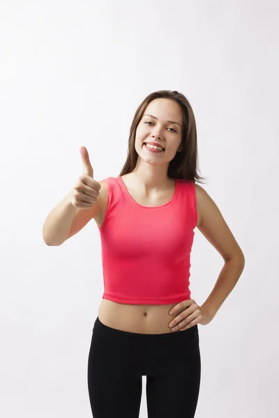 Güzel genç atletik kız başparmak ortaya çıktı