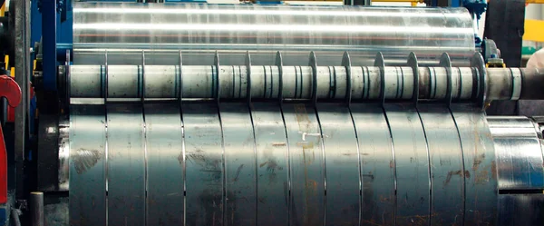 Steel sheets rolled up into rolls.