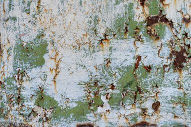 Metal bir zeminde paslı aşınma. Metalik bir yüzeyi soyan boya. Metal temel pas, dökülen boya.