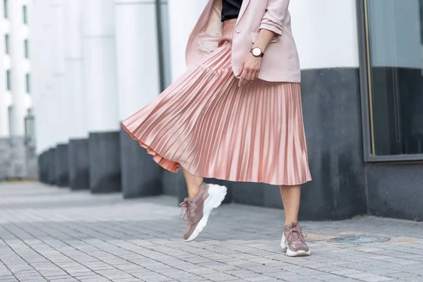 Peach colored A Line Pleated Skirt, sneakers
