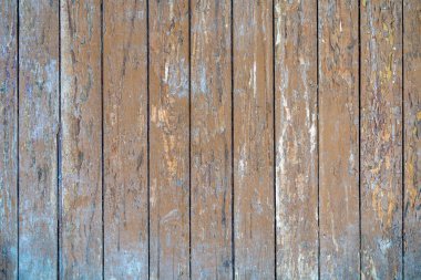 Eski boyalı ahşap kalaslar zamanla soyuluyor. Eski tahtaların ahşap yüzeyinden dökülen boya. Eski boyanmış tahtaların dokusu