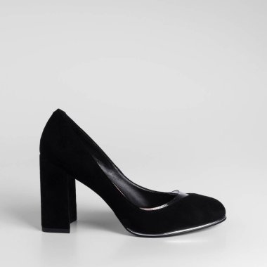Women black suede shoe with transparent inserts on a high thick heel. Close-up. Catalog shooting