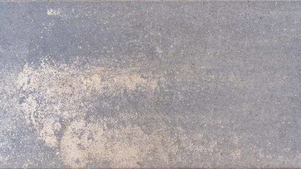 Gri beton yüzey dokusu. Yol yüzeyindeki taş levha. Gri soyut desen