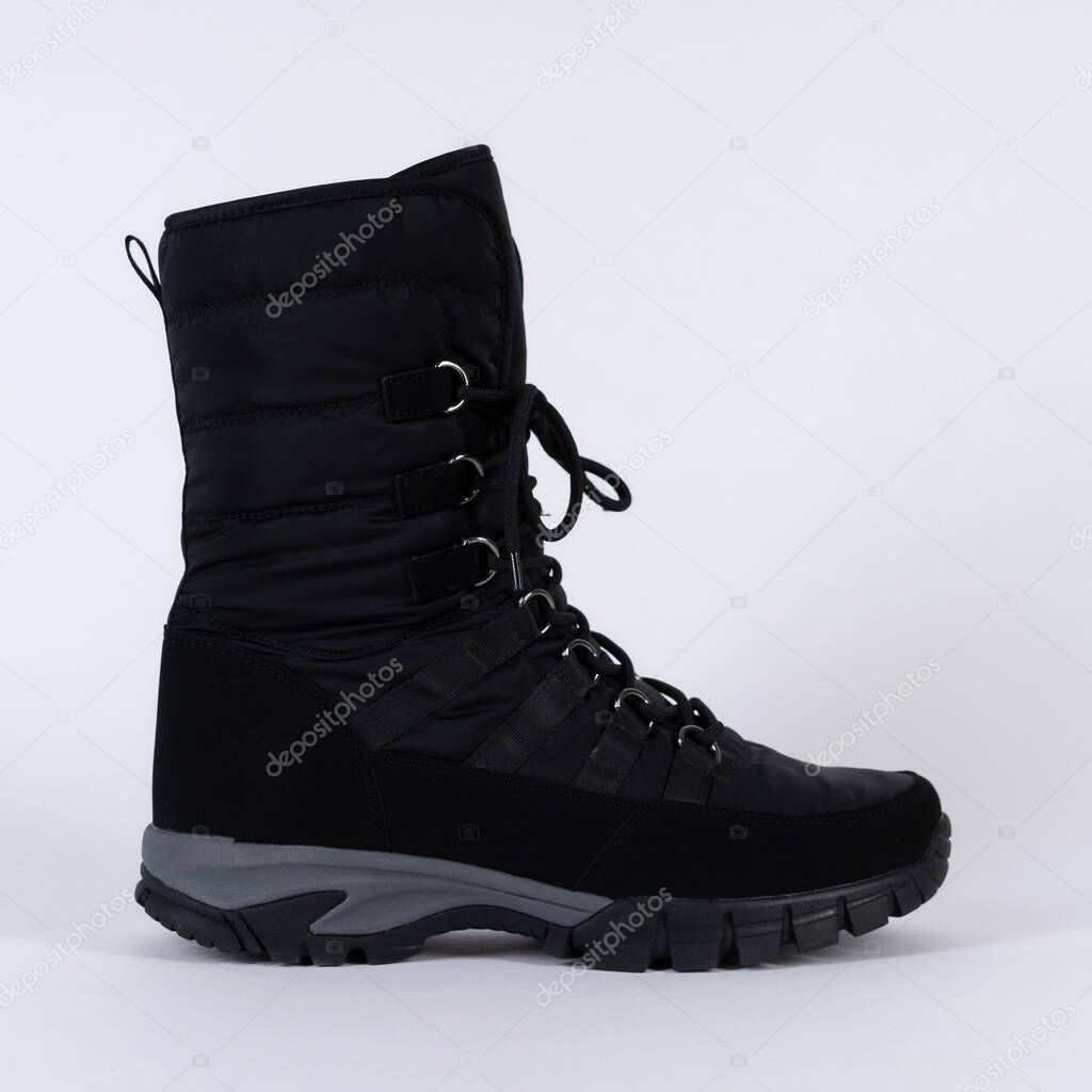 boot winter high warm soft waterproof lace up. On white background.