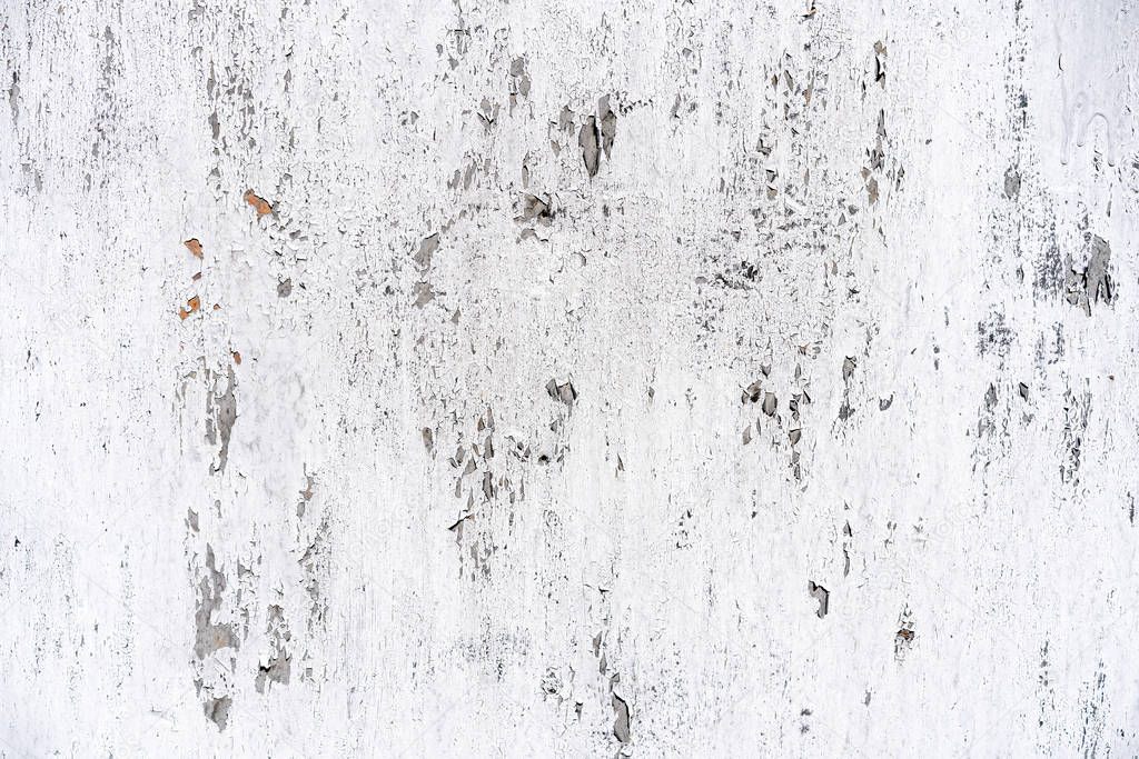 background shabby white wall. White plaster with scuffs. Scuffed on a white wall. Old white plaster wall texture.