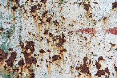 Metal bir zeminde paslı aşınma. Metalik bir yüzeyi soyan boya. Metal temel pas, dökülen boya.