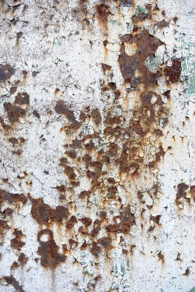 rusty corrosion on a metal base. Paint peeling off a metallic surface. Metal base rust, paint peeling off