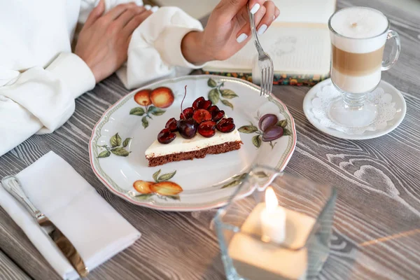 cherry cheesecake with latte in a cafe. Homemade breakfast with coffee. Great morning mood