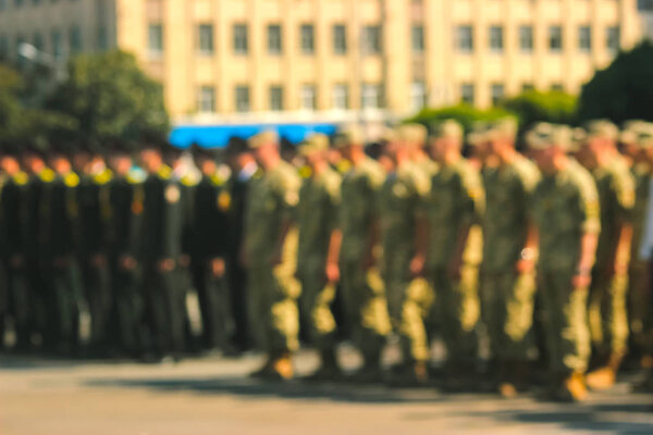 Blurred background, military parade, rows of soldiers