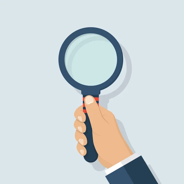 Magnifying glass in hand — Stock Vector