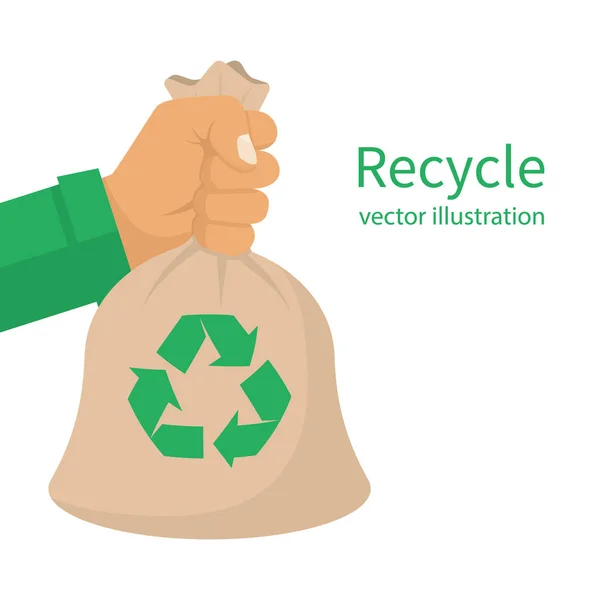 Recyklovat vak drží ruka — Stockový vektor