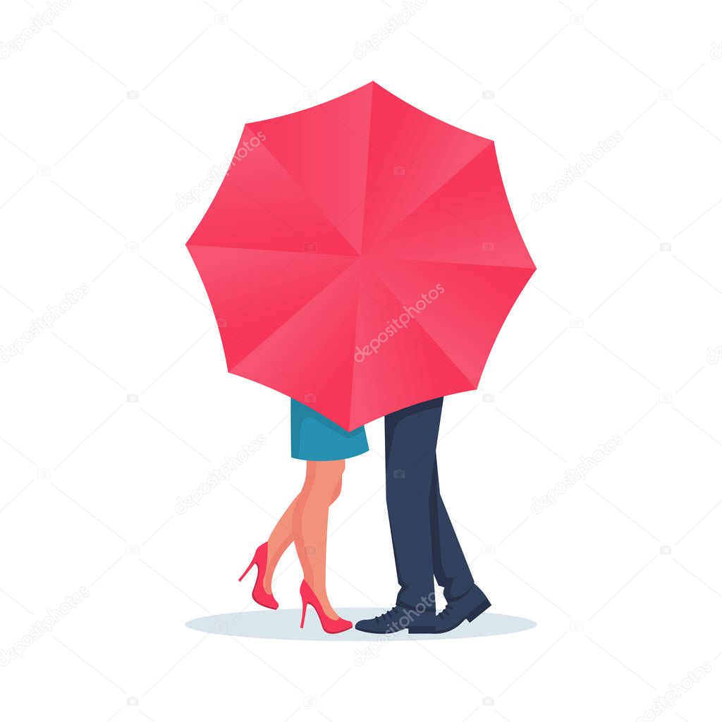 Amorous couple guy and girl kiss behind an umbrella