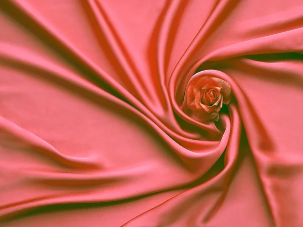 Red Silk And Rose Petals. rose on a silk abstract background. Valentines day with copy space for add text.