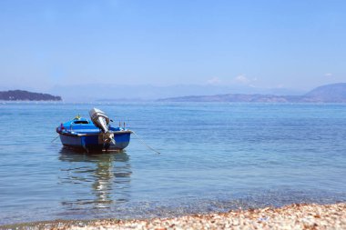 Blue Boat at the sea in summer day time. Sunny weather. travel and vacation. Blue lagoon summer sea and blue boat.