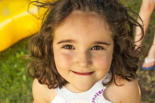 Close up portrait little girl looking at camera