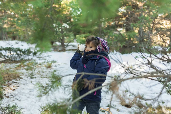 Throwing snow balls in the snow-covered mountain