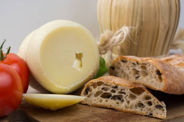 Best Italian food - fresh caciocavallo cheese, red wine, olive b clipart