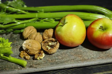 Ingredients for Waldorf salad -  celery, apples, walnuts clipart