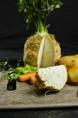 Ingredients for celeriac soup - celery root - celeriac, carrots, onion, potatoes - healthy diet concept clipart