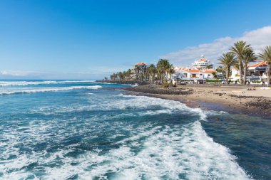 Ocean coast in the tourist resort Playa de las Americas, Tenerife clipart