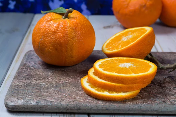 Giant ripe organic oranges from farm in Spain with leaves