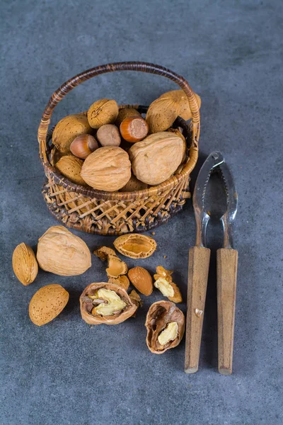 Nuts mix in shell - walnuts, hazel and almonds with nut chaker o
