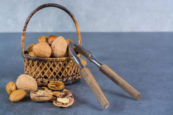 Nuts mix in shell - walnuts, hazel and almonds in wicked basket