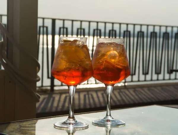 Waiter prepared the Aperol Sprits summer cocktail with Aperol